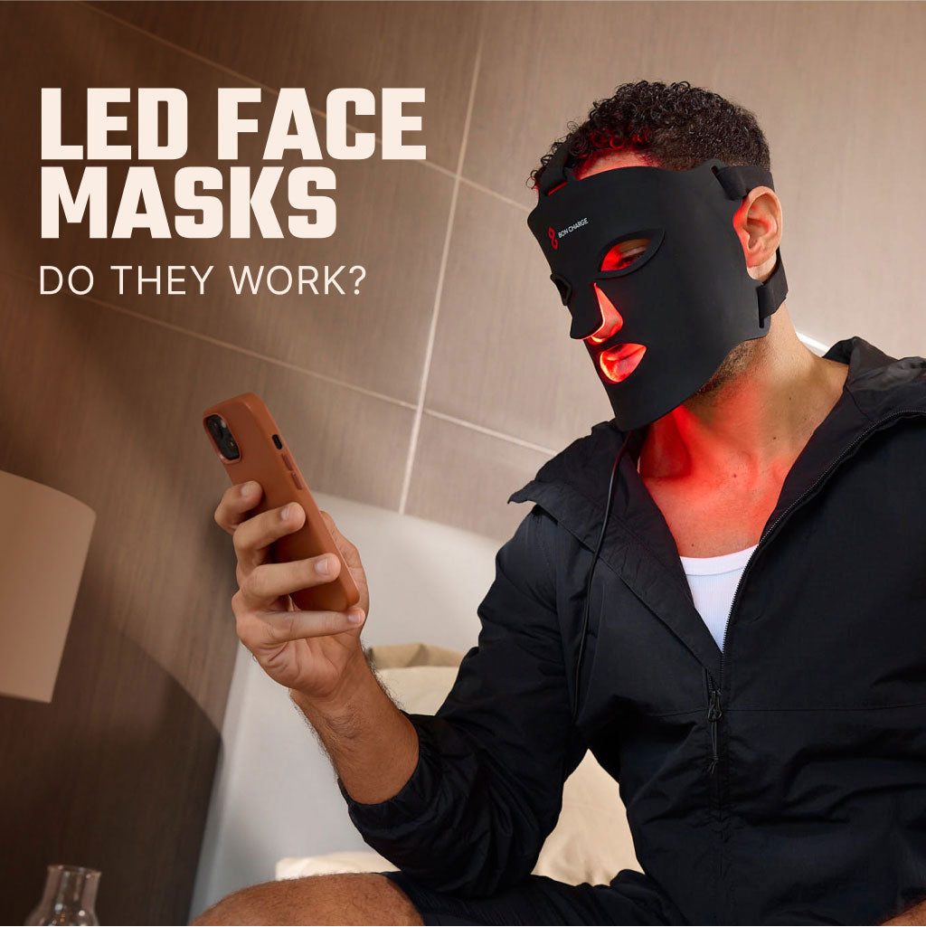 Man Wearing Red Light Face Mask Using Phone