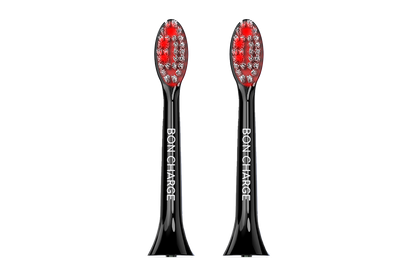 Black electric toothbrush head with red bristles